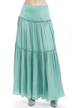 The Lila is a maxi skirt with a yoked waist and ruffle topped tiers. Shown here in our soft rayon with a slight shinny face. Content: 100% Rayon Color: Mint Fits: Relaxed fit, should fit with ease Sizes: XS-L What we Love: Casual shape with great color and a little skin Limited Edition, Sewn In Los Angeles with Love Model is 5'9" size 2/4 and is wearing a size S Turquoise Top Outfit, Autumn Skirts, Aqua Outfit, Mint Skirt, Turquoise Skirt, Teal Outfits, Fairy Skirt, Cow Farm, Tiered Maxi Skirt