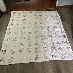 a white rug with red flowers on it