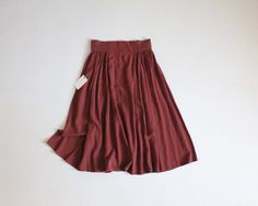 1990's rust brown, full and flouncy midi skirt by Liz Claiborne with an extra high, wide-band waist, side pockets, and back zipper. Lightweight and flowy rayon.  Fits Like: Medium/Large Vintage Label Size: 10 Circa 1990;s Fabrication: 100% rayon Condition: excellent! Measurements: 30-32" waist  full hip  32" length Rock Rock, Brown Skirt, Brown Skirts, Vintage Labels, Wide Bands, Label Sizes, Liz Claiborne, High Waisted Skirt, Midi Skirt