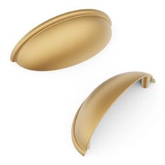 two shiny gold door handles on a white background with clipping path to the left