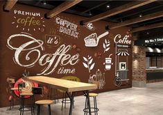 an empty coffee shop with chalk writing on the wall