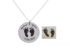 a silver necklace with a baby's footprints on it and a photo of the foot print