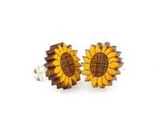 two wooden sunflowers on white background