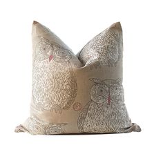 an owl pillow on a white background