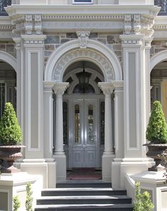 an entrance to a building with steps leading up to it