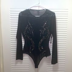 This Is A Black Mesh Bodysuit With Sequins In The Shape Of Dragons. It’s Brand New With The Tags Still On, Never Been Worn. I Love It, But Just Never Had A Place To Wear It! Black Sequin Bodysuit For Party, Black Sequined Party Bodysuit, Stretch Long Sleeve Bodysuit For Party Season, Fitted Bodysuit With Lined Body For Party, Fitted Party Bodysuit With Lined Body, Elegant Black Bodysuit With Sequins, Glamorous Black Stretch Bodysuit, Black Fitted Bodysuit For Night Out, Elegant Black Sequined Bodysuit