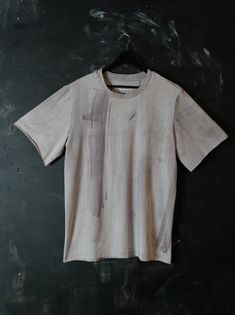 "Naturally dyed cotton t-shirt. Loose fit long minimalist t-shirt. Raw edge sleeves. Fabric is hand dyed using organic plant matter. Each piece is dyed individually and no two can ever be the same. Size L Measurements: Chest: 47\" (120 cm)  Bottom: 48\" (122 cm)  Sleeve: 11\" (28 cm)  Shoulders: 20\" (50 cm)  Length: 31\" (78 cm)  One of a kind top! #223" Distressed T-shirt, Hand Dyed Washed Black Short Sleeve T-shirt, Faded Short Sleeve Top With Screen Print, Faded Crew Neck T-shirt With Screen Print, Acid Wash Bleached Crew Neck T-shirt, Hand Dyed Washed Black Crew Neck Top, Washed Black Bleached Crew Neck T-shirt, Hand Dyed Crew Neck T-shirt For Streetwear, Hand Dyed Washed Black Crew Neck T-shirt