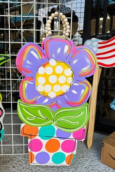 a colorful flower shaped box sitting on top of a counter next to other items and decorations