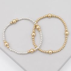 One of our best! A "currently classic" style from the Beaded Lux collection. Each station is precisely set and elevates the design. Just slip one on and you'll instantly know what we mean by one just instant enough and maybe two isn't either! 3mm beads paired with 3 & 4mm 14k gold filled beads set in four stations. Choose from all gold beads or pair with sterling silver for a mixed metal look. Easy wear and effortless stacking with sturdy stretch cord design. Sizing options to make a perfect, co Classic Hand-strung Stretch Bracelet For Everyday, Classic Adjustable Hand-strung Stretch Bracelet, Classic Beaded Bracelets With Round Beads For Everyday, Classic Beaded Bracelets For Everyday, Classic Everyday Beaded Bracelets, Classic Adjustable Stretch Bracelet, Classic Bracelets With 8mm Beads For Everyday, Classic Everyday Bracelet With 8mm Beads, Classic Everyday Beaded Bracelets With 8mm Beads