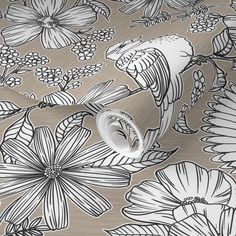 a metallic wallpaper with black and white flowers