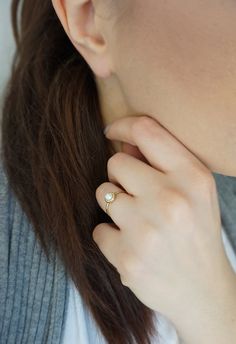 14K 9K Gold Solitaire Pearl Ring, Minimalist pearl ring, Dainty pearl ring, Stacking ring, Promise ring, Engagement ring, Gift for her, 14K Rose gold ring, Gift for her, Anniversary ring, FREE EXPRESS SHIPPING Beautiful and delicate white pearl ring made in 14K or 9K solid gold. The pearl is natural and not colored. Whisper...Always on trend! ;) -------------------------------------------------- D E T A I L S 14K or 9K Solid Gold Natural White Pearl 5mm Band width 1.4mm ------------------------- Everyday Pearl Open Ring, Everyday Open Pearl Ring, Elegant Everyday Open Moonstone Ring, Minimalist Pearl White Ring With Pearl Drop, Everyday Pearl Ring With Charm, Elegant Everyday White Opal Ring, White Elegant Everyday Opal Ring, Minimalist Pearl Drop Ring For Wedding, Delicate 14k Gold Pearl Ring For Anniversary