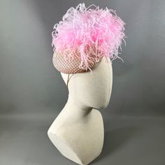 Pure textural joy with a light pink crystal mesh overlay and a cloud of floaty ostrich feathers. The subtle sparkle and light movement will bring elegant whimsy to any outfit. Elastic and comb attachment for easy, comfortable wear. Lifted Millinery headwear is constructed with time honored techniques and fine craftsmanship. All hats are meticulously blocked and sewn by hand without the use of adhesives to attach trims. This ensures a long lasting hat with the ability to be retrimmed throughout t Light Pink Crystal, Light Movement, Pink Feathers, Hat Box, Mesh Overlay, Ostrich Feathers, Pink Crystal, Fascinator, Comb