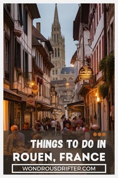 a narrow street with people walking down it and the words things to do in rouein, france