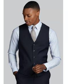 Upgrade your formal attire with the Jos. A. Bank Tailored Fit Suit Separates Solid Vest in Navy. Designed for comfort and sophistication, this vest offers a sharp, tailored fit that enhances any suit or dress shirt, perfect for weddings, business events, or special occasions. *  Elegant Navy Vest: A versatile, timeless color that pairs seamlessly with a wide range of suit styles. *  Tailored Fit: Provides a sleek, modern silhouette while maintaining all-day comfort. *  Size 2X Large Big: Specifically designed for larger frames, offering a flattering fit without compromising on style. *  Perfect for Formal Occasions: Ideal for business, weddings, or formal events, adding a refined touch to your look. *  Premium Fabric Construction: Crafted from high-quality materials, ensuring durability an Elegant V-neck Vest For Formal Occasions, Classic V-neck Suits For Semi-formal Occasions, Classic V-neck Semi-formal Suits, Classic Suits With Vest For Work, Fitted Suit Collar Vest For Work, Fitted Vest With Suit Collar For Work, Elegant Business Casual Suits With Vest, Classic Business Casual Vest Top, Classic Fitted Vest For Office Wear