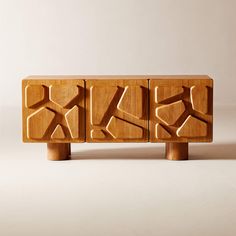 two wooden blocks with different designs on them