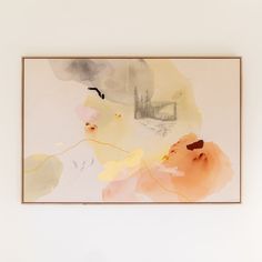 an abstract painting hangs on the wall