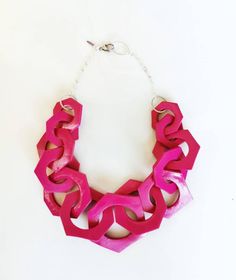 Oversized chunky chain necklace entirely handmade link by link from polymer clay in magenta pink, finished with silver or gold plated chain. Lobster clasp closure on the back.►Length: From 18 to 30 inches // Modeled necklace is 28 inches long (71cm) and is for size reference only! You can find the modeled red link necklace here: https://www.etsy.com/shop/AlinaandT?ref=seller-platform-mcnav&search_query=red+link►Chain links are approx 2 3/4 - 2 1/2 long  inch and smaller in the ends of the ne Pink Chain Link Necklace For Gift, Pink Chain Link Necklace With Adjustable Chain, Pink Chunky Chain Link Necklace, Pink Chunky Chain Necklace As Gift, Bold Pink Jewelry For Gifts, Pink Chunky Link Chain Jewelry, Pink Chunky Chain Link Jewelry, Pink Chunky Chain Necklace For Gift, Designer Jewelery