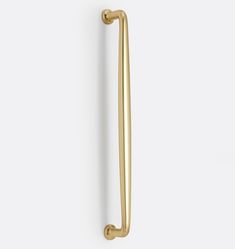 a gold door handle on a white wall