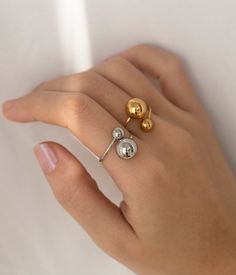 Stainless steel gold or silver double ball resizable ring. Width: 16.5mm or 0.64'' Shipping details: 1 business day, priority shipping is an option. All items come shipped in a protective jewelry box. Returns and exchanges have a 30 day policy. Check out my shop for more items:  https://www.etsy.com/shop/TenthRealmJewelry Please message me with any questions or concerns you may have, I'll respond instantly! Thank you for checking out my shop, enjoy! :) Protective Jewelry, Etsy Gold Ring, Ring Simple, Ear Rings, Open Ring, Rings Statement, Gold And Silver, Gold Ring, Statement Rings