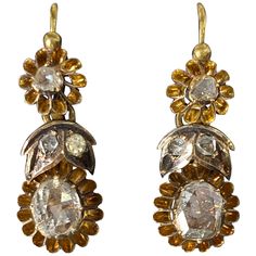 These beautiful earrings date back to the late 19th century, created during the Austro Hungarian empire. Hallmarks tell us these rare and charming, antique rose-cut diamond earrings hail from late-19th century. Warm rosy-yellow 14 karat buttercup settings set the shimmering rose-cut diamonds off to beautiful effect. The earrings are day to night earrings, meaning that you can wear the tops alone or add the body for a dramatic look. The ear wires are hinged that clasp at the front. The craftsmanship of long gone times is visible and can be admired today as the pieces are in amazing condition. The would make an amazing addition to any jewelry collection! Material: 14k Yellow Gold Rose Cut Diamond Origin: Austro Hungarian Empire (circa 1872-1922) 32mm long - without drop they are 10.3 mm Russian Jewelry, Austrian Empire, Georgian Jewelry, Austro Hungarian, Hot Jewelry, Diamond Gold, Day To Night, Cluster Earrings, Gold Drop Earrings