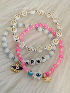 🌟 Set of 3 Karma & Evil Eye Bracelets 🌟 Embrace positivity and style with this exquisite set of 3 bracelets! Each unique design features meaningful charms and vibrant colors, perfect for adding a touch of luck to your accessory collection. Bracelet 1: Crafted with white beads accented by blue pearl beads, featuring a striking blue evil eye charm and the word "Karma" spelled out in beads, promoting good energy and protection. Bracelet 2: Made with silver beads adorned with flatback heart charms Heart Bead Bracelet, Eye Bracelets, Protection Bracelet, Blue Evil Eye, Pink Eyes, Eye Bracelet, Evil Eye Charm, Pink Marble, Evil Eye Bracelet