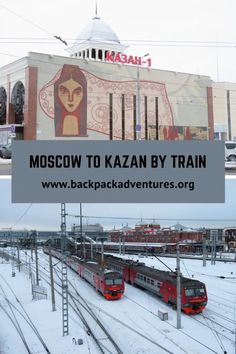 two trains on tracks in front of a train station with the words moscow to kazn by train