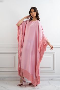 Featuring: Silk fringe Satin fabric Butterfly sleeve caftan Luxurious fringe sleeves and hem Free size Fabric:Fringes - 100% Silk.Bodice Fabric - 100% Satin.Color: PinkBrand: Unmatched BYU Size: Free size. (Fits between size 2 US up to size 20 US).Length: 47 inches.This caftan is available in multiple colors Spring Maxi Kaftan With Tassels, Fringe Floor-length Maxi Dress, Evening Kaftan With Tassels, Elegant Long Dress With Tassels, Elegant Pink Dresses With Tassels, Elegant Pink Tassel Dresses, Spring Fringe Tunic Dress, Elegant Long Sleeve Kaftan With Tassels, Spring Tunic Dress With Fringe