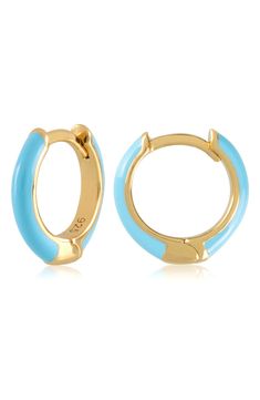 Easy-to-wear hoop earrings will add significant polish to even your most casual ensembles. 1/2" drop; 1/8" width Hinge with snap-post closure Sterling silver with goldtone plate/enamel Imported Blue Hypoallergenic Hoop Earrings, Adjustable Small Hoop Earrings In Blue, Adjustable Small Blue Hoop Earrings, Blue Hypoallergenic Small Hoop Earrings, Blue Hypoallergenic Hoop Jewelry, Trendy Small Blue Hoop Earrings, Everyday Round Enamel Earrings, Hypoallergenic Blue Hoop Jewelry, Trendy Nickel-free Blue Hoop Earrings