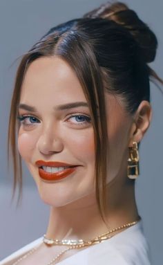 a woman with orange lipstick on her lips