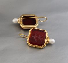 Description Gemstone - Red Glass Material - Brass Gemstone Size - 18 mm Earring Height Including Hoop - 4 cm Earring Width - 2.3 cm Finish - Smooth and high polished with brilliant shine. Note -The earrings are made to order, production day is about 3-5 working days. The one you receive may be slight different from the one in the picture due to handmade nature, but it will be almost same as in the above picture.These pieces are handcrafted from start to finish and have an imperfect handmade look.These earrings are the perfect addition to your collection. Our rings are meant to be classic enough for everyday wear or to give as a bridesmaid gift. You will receive the same piece as in the picture or identical. Since all gemstones are different from each other, I cannot guarantee that the gems Red Gemstone Pendant Earrings, Red Pendant Earrings For Anniversary, Red Cabochon Earrings Perfect For Gifts, Red Cabochon Earrings For Gift, Red Cabochon Earrings For Wedding, Jewlery Rings, Silver Jewlery, Add Image, Printed Dress Shirts