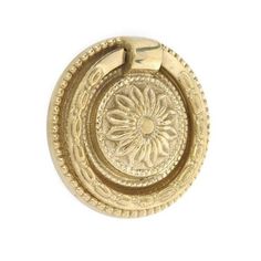 an image of a gold plated metal object on a white background with clippings