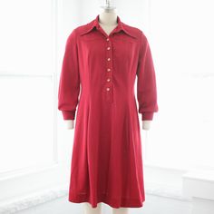 A lovely 1960s scooter dress with western yoke, dagger collar, metallic button front, and pleated skirt. Soft medium weight woven polyester fabric in a pretty shade of berry red. Measurements of garment, allow space for fit.Taken flat, doubled for circumferenceShown on a size 4 dress formModern Size Estimate: medium, largeBust: 39”Waist: 34”Hips: 40”+Shoulder: 16”Length: 38.5”Sleeve: 21.5” Swing: 56”Tag: NPC Fashions Fabric: PolyesterCondition: Excellent vintage. Classic A-line Shirt Dress For Fall, Retro Red Button-up Dress, Vintage Collared Dresses For Work, Vintage Collared Dress For Workwear, Classic Vintage Dress For Fall Workwear, Classic Fall Vintage Dress For Workwear, Classic Vintage Dress For Work In Fall, Formal Fall Dress With Peter Pan Collar, Fitted Shirt Dress With Collared Neckline For Fall