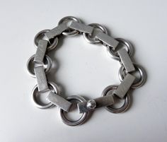 "An amazing piece of silver-smithing design history. A beautiful piece of Scandinavian design. Stunning bracelet designed by Scandinavian silver giant, Bent Knudsen for the silver-smithing company that he started in 1956.   c.1958-60 Heavy Sterling Silver bracelet (60) Condition excellent for a 60 year old piece of jewellery Weight 68.5 grams Length 7.5\" Width 18mm Hand made screw catch Bent Knudsen (1924-1997) worked at various gold and silversmiths in Copenhagen Denmark before he came to Hans Silver Smithing, Hand Cuff Bracelet, Mid Century Modern Scandinavian, Wire Cuff, Modernist Jewelry, Modern Scandinavian, Metal Chain Link, Copenhagen Denmark, Design History