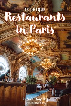 the inside of a restaurant with chandeliers and paintings on the ceiling, in paris