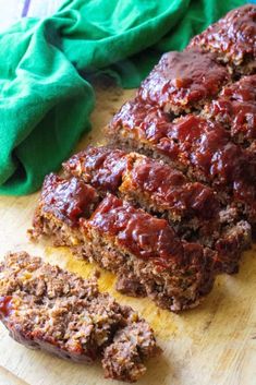 slices of meatloaf sitting on top of a cutting board