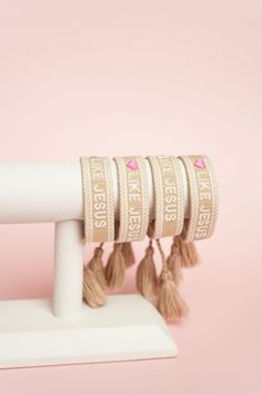 Love Like Jesus! Tan embroidered bracelet with white and pink stitching. Our embroidered bracelets are adjustable to fit any wrist and are machine washable! White Embroidered Bracelets For Friendship, White Embroidered Beaded Bracelets As Gift, White Embroidered Bracelet As Gift, Embroidered Bracelet, Love Like Jesus, Stitching, Jesus, Bracelet, Pink