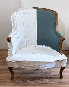 an old chair is covered in white fabric and has been painted blue with the same color