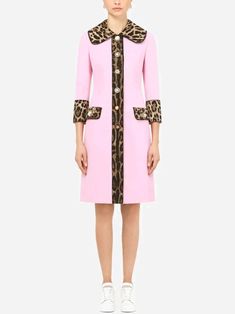 The Dolce & Gabbana Leopard Print Trench Coat. A lightweight, single-breasted coat in wool crepe and with round neckline subtle bejewelled button fastenings. long sleeves are trimmed stretch satin lining, while flap pockets provide functional, elegant finish. Luxury Pink Single Breasted Outerwear, Luxury Pink Single-breasted Outerwear, Luxury Pink Outerwear With Buttons, Designer Wool Coat With Hidden Buttons, Designer Wool Coat With Hidden Button Closure, Tailored Designer Long Sleeve Wool Coat, Designer Single Breasted Wool Coat, Designer Single-breasted Wool Coat, Designer Pink Outerwear With Button Closure