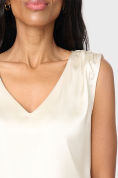 The Reverly Cinched Detail Satin Top is a sophisticated wardrobe staple. Crafted from luxe silky fabric, it features cinched shoulder details for subtle definition and a flattering V-neckline. Perfect for special occasions or a everyday look. Created in collab with @cassiesugarplum 96% Polyester | 4% Spandex Delicate Wash Cycle, Dry Flat. Length 25" (size small) Danielle is 5'3 wearing size XXS in Champagne. Sabrina is 5'7 and is wearing XXS in Black. Sophisticated Wardrobe, Silky Fabric, Silk Tank, Satin Blouse, Satin Top, Everyday Look, Wardrobe Staples, Champagne, Special Occasion