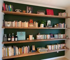 the bookshelves are filled with many different types of books and magazines on them