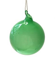 a green glass ornament hanging from a rope