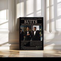 an advertisement for suits on the wall