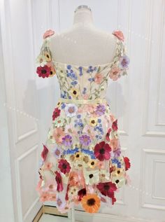 a dress made out of fabric with flowers on it