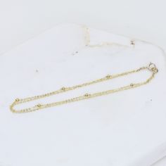 "14K Gold Dainty Multi Chain Bracelet - 14K Gold Double Chain Bracelet - 14K Solid Gold Bracelet ★ The chains and all components are 14K solid yellow gold ★ The tiny round beads are 1.7mm The length includes the chain and the closure. Please measure your wrist before you place your order. ** How to choose a correct size of bracelet. 1. Measure your wrist below the wrist bone using a flexible tape measures, a string or a strip of paper. 2. If using a string or a strip of paper, mark length. Then, Multi Chain Bracelet, Double Chain Bracelet, Gold Heart Bracelet, Mother Daughter Necklace, Solid Gold Bracelet, Tape Measures, Daughter Necklace, Double Chain, Solid Yellow