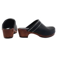 Clog made in Italy with black base in POLYURETHANE (wood effect) Upper in black leather - also ideal for sanitary use Entirely made by specialized Italian personnel Handcrafted using the best materials Heel height 5 cm-Non-slip Rubber Very comfortable and elegant. Black Slip-on Clogs With Rubber Heel Cap, Black Leather Clogs With Removable Insole, Black Leather Clogs With Reinforced Heel, Black Mules With Rubber Heel Cap, Black Mules With Rubber Heel Cap And Round Toe, Black Leather Clogs With Rubber Sole, Black Leather Footbed Clogs With Round Toe, Black Closed Toe Clogs With Wooden Heel, Black Closed Toe Clogs With Removable Insole