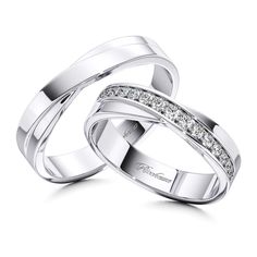 two white gold wedding bands with diamonds