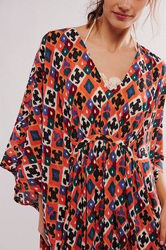 Billowy and breezy, vibrant and eye-catching, this so special kaftan is perfect for brunches, beach days, and everything in between. **Fit:** Maxi length, relaxed and oversized **Features:** Super mod, retro print, relaxed sleeves, pull-on style, deep-v neckline, ruched detailing, soft comfy fabrication **Why We | Groovy Baby Maxi Kaftan Dress by Free People Bohemian V-neck Kaftan For Brunch, Maxi Length Beachwear Cover-up For Brunch, Bohemian Multicolor Print V-neck Kaftan, Bohemian Multicolor Tunic Cover-up, Bohemian Spring Brunch Cover-up, Patterned Kaftan For Summer Beach Cover-up, Summer Bohemian Dress With Ikat Print, Summer V-neck Tunic For Festivals, Patterned V-neck Kaftan For The Beach