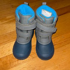 Never Worn, No Tags With Exception Of Plastic On Back Of Right Boot. Size 7. Gray & Navy, Bright Blue Interior. Perfect Condition. Blue Non-slip Boots For Outdoor, Casual Insulated Gray Boots, Gray Insulated Boots With Round Toe, Insulated Gray Boots With Round Toe, Casual Insulated Blue Boots, Bright Blue Interior, Toddler Duck Boots, Boys Ankle Boots