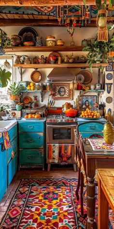 an old fashioned kitchen with blue cabinets and colorful rugs on the floor, along with potted plants