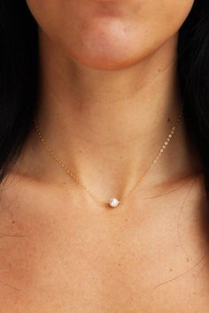 A simple, classic single 6mm pearl graces a dainty, diamond cut minimalistic chain.  Perfect for anyone and everyday!- 14K Gold Filled Chain or Sterling Silver- Swarovski crystalline pearl- Choose length from drop down- Comes perfectly packaged for gift giving! Minimalist Everyday Jewelry With Pearl Charm, Minimalist Solitaire Necklace For Anniversary, Minimalist Pearl White Pearl Necklace With Clavicle Chain, Minimalist Solitaire Necklace Gift, Simple White Clavicle Chain Charm Necklace, Minimalist Everyday Pearl Pendant Jewelry, Dainty Solitaire Necklace For Anniversary, Elegant White Charm Necklace For Everyday, Minimalist Pearl Pendant Charm Necklace For Everyday